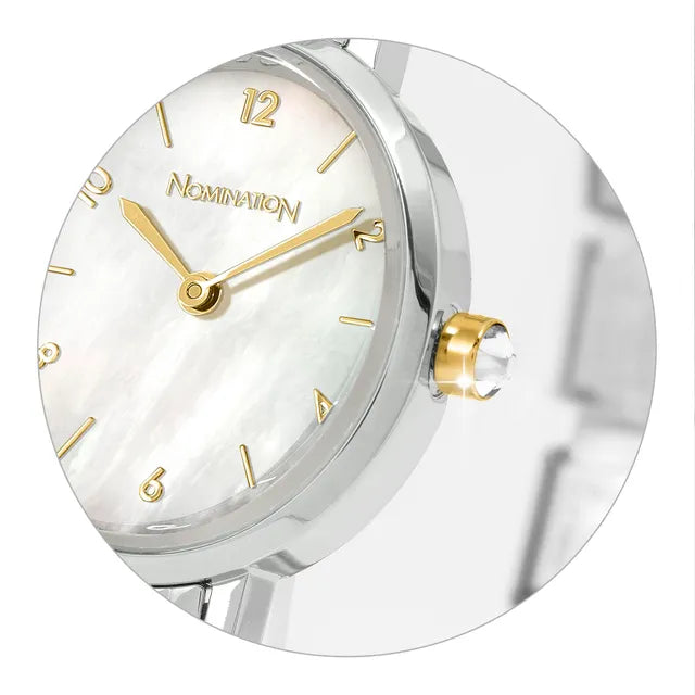 Silver and gold clock with 'Nomination' brand on a white background