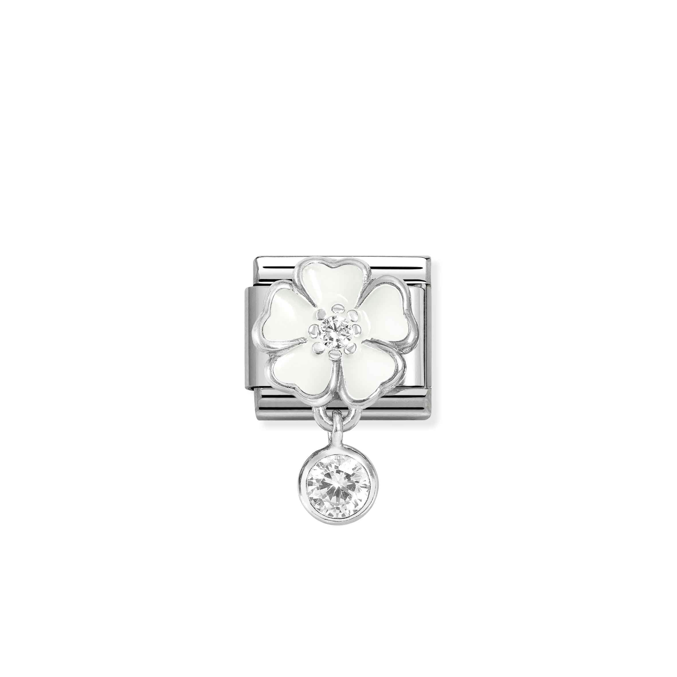 Silver charm with a white flower and clear gemstone on a white background