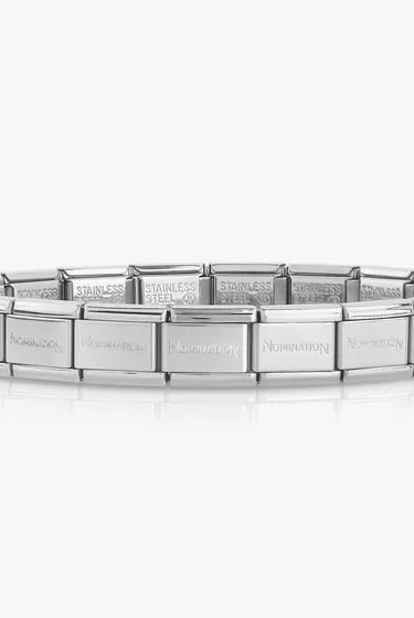Silver bracelet with engraved text on a white background