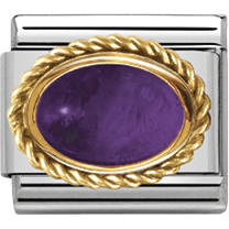 Gold and silver charm with a purple stone on a white background