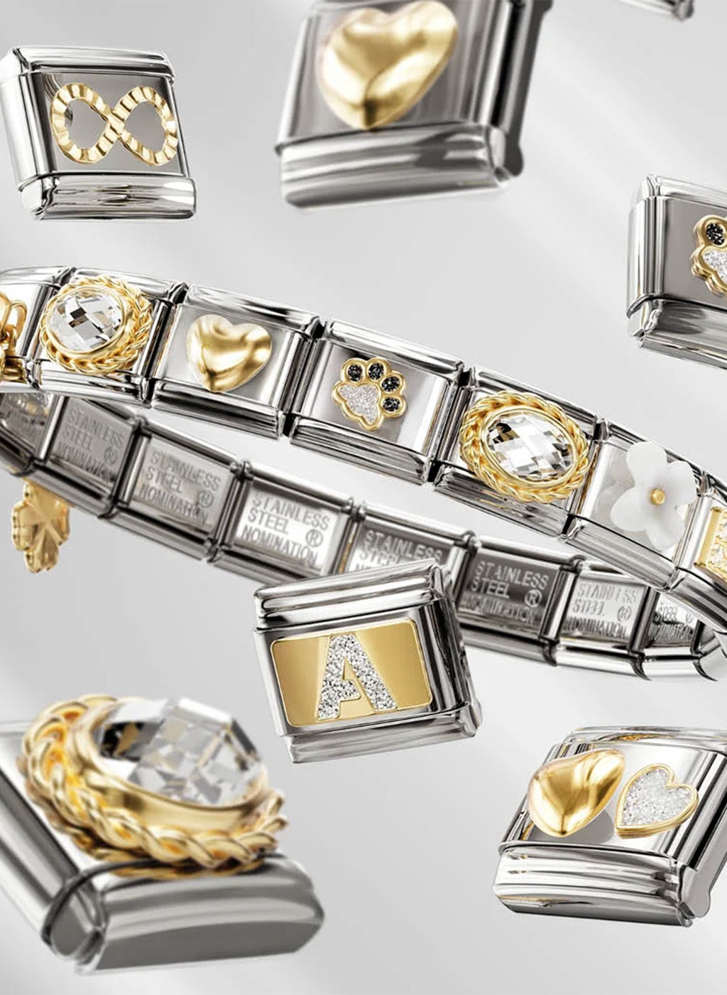 Bracelet with various charms including hearts and letters on a light gray background