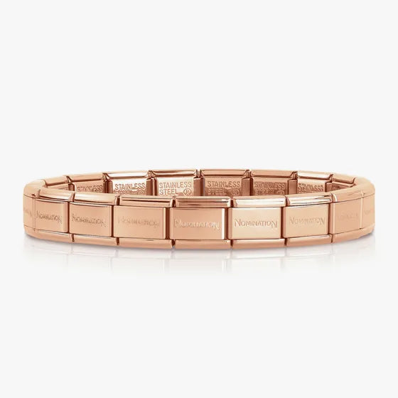 Rose gold bracelet with brand name on a white background
